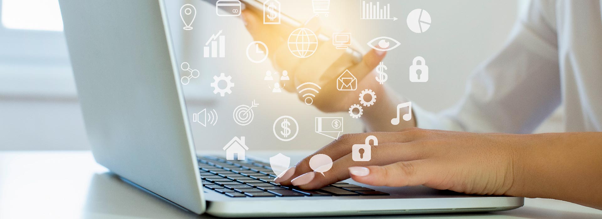 Female on laptop with icons